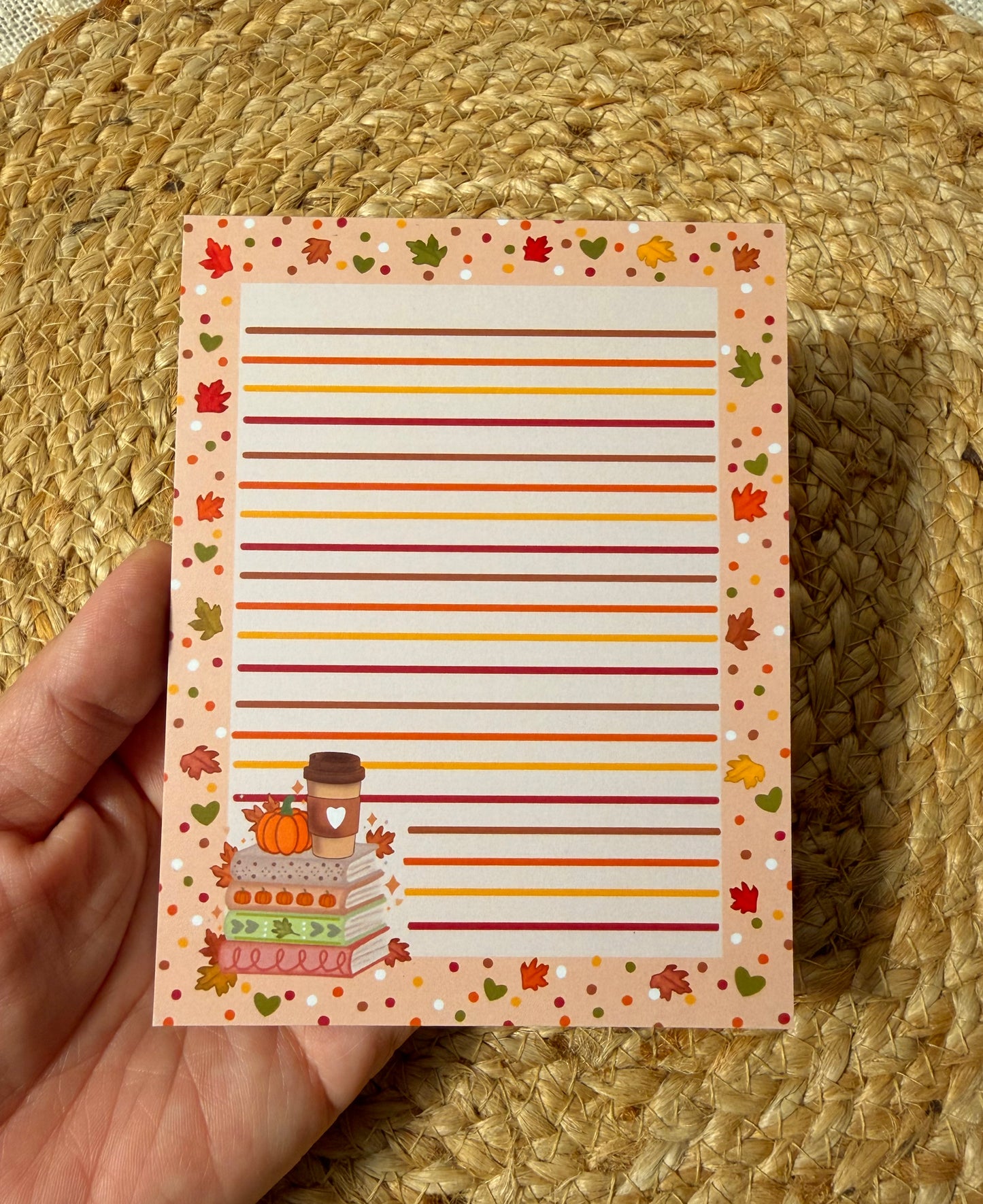 Autumn Chapters Pumpkin Spice Latte notepad by Milabell Paper Co. held in hand.