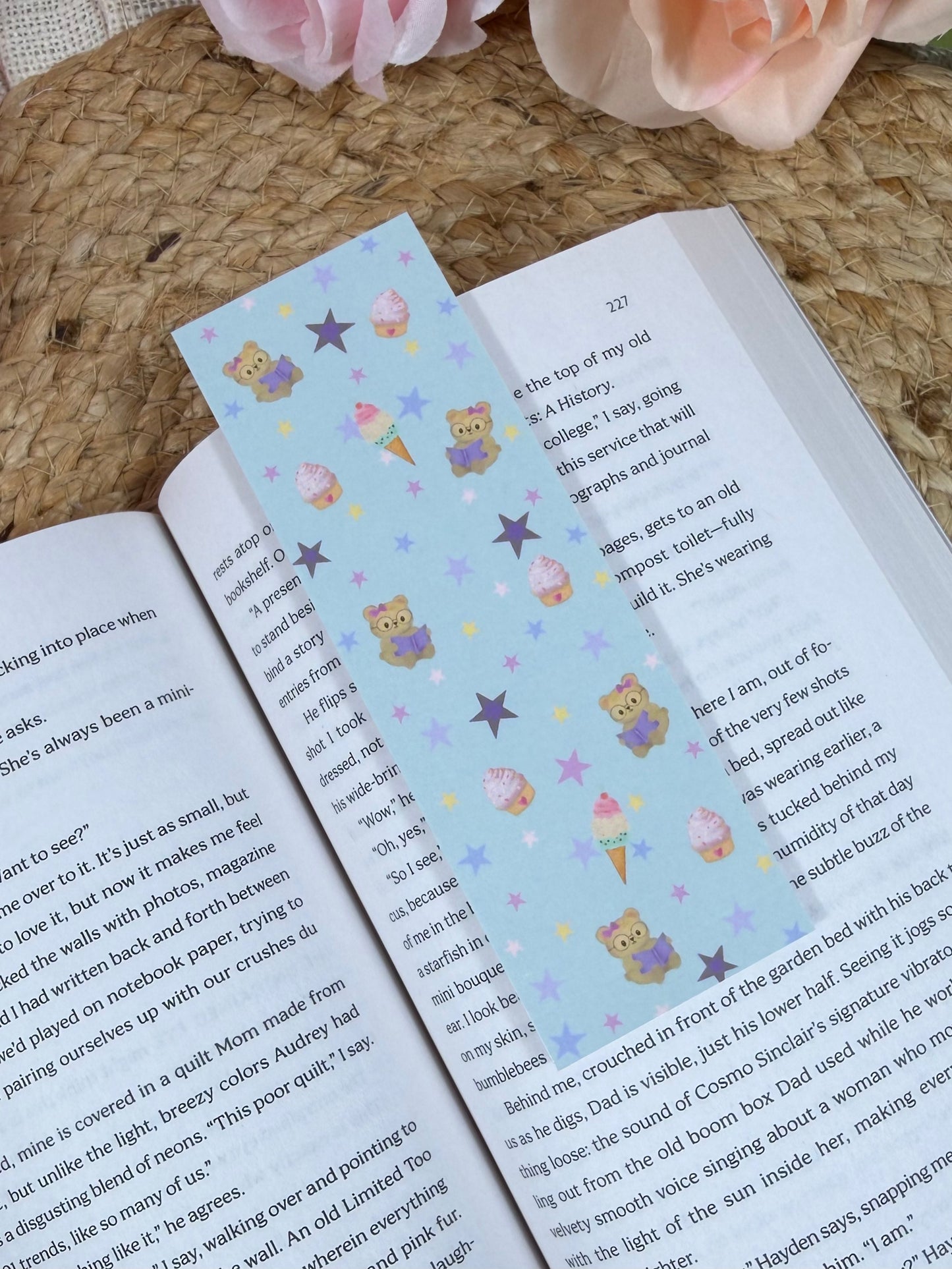 Sweet Tooth Teddy Bookmark marking a page inside a book.