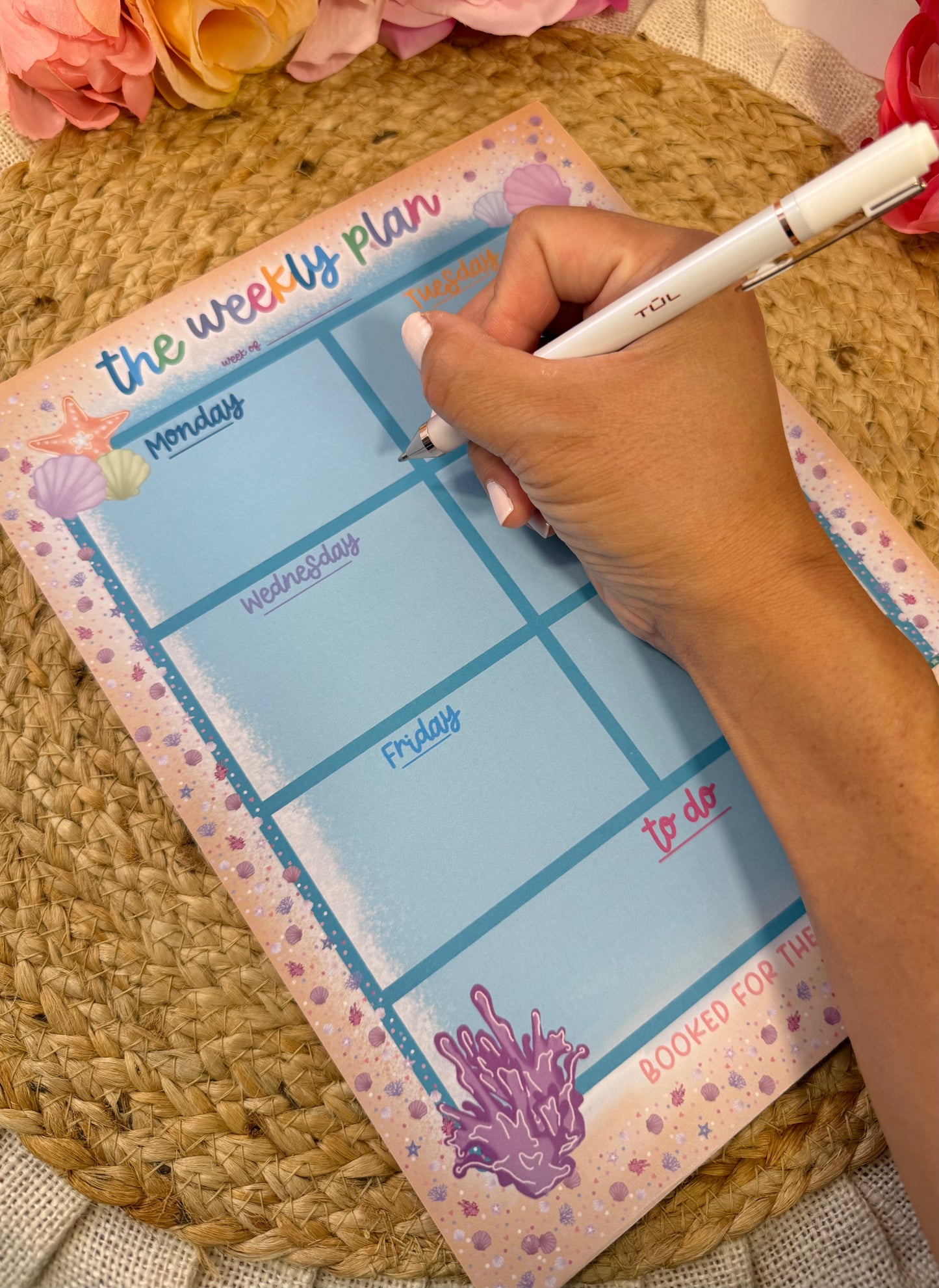 Beach Booked Weekly Planner with writing to demonstrate the weekly layout and writing space.