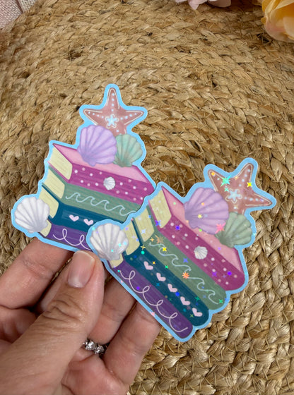 Beach Books Vinyl Sticker shown in Vinyl Glossy and Vinyl Star Holographic finishes.