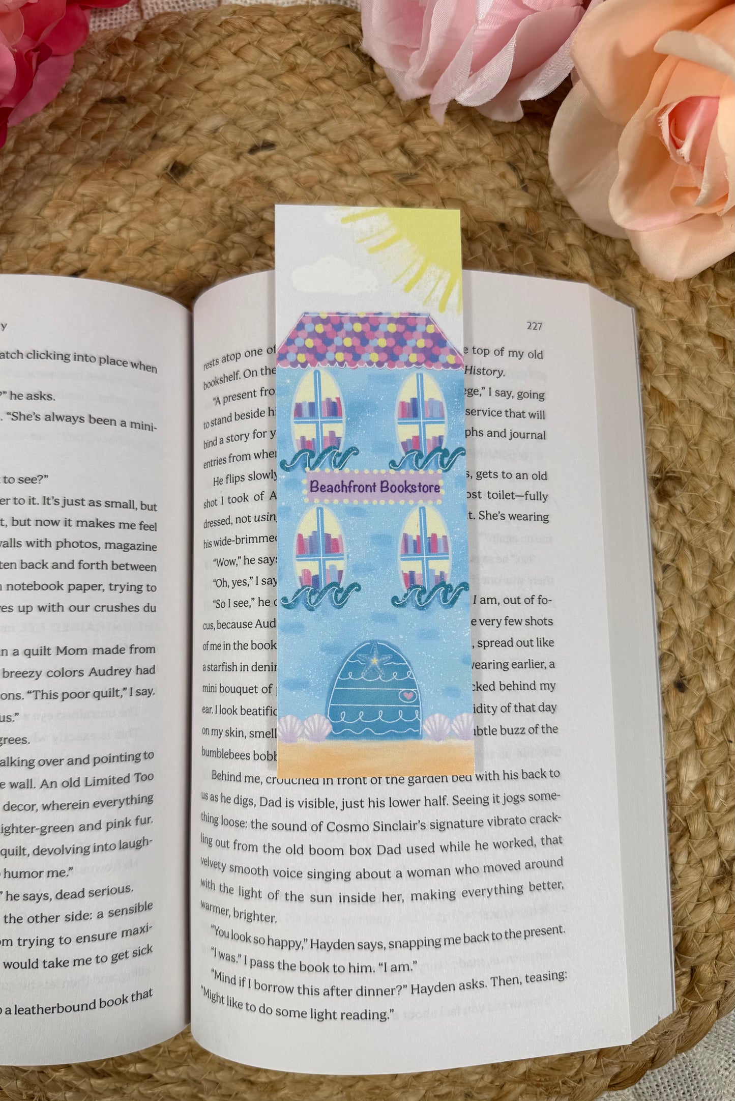 Beach Bookstore Bookmark marking a page inside a book.