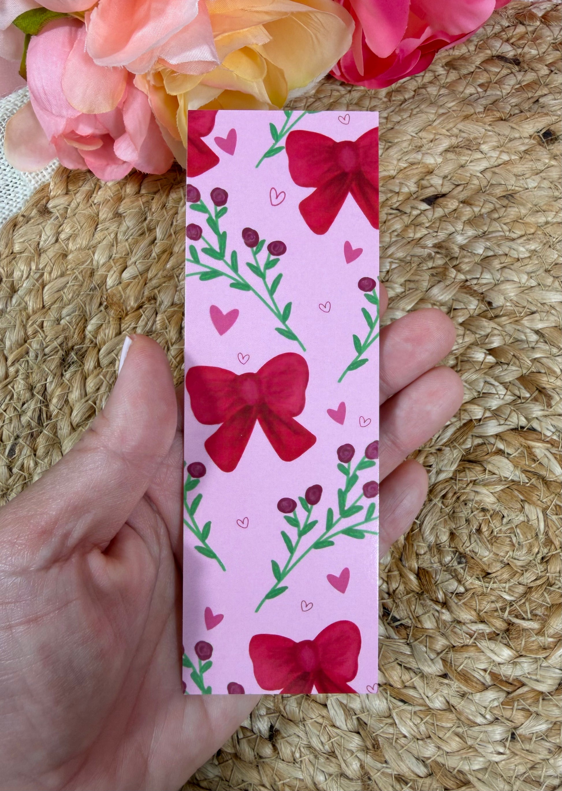 Bows & Blooms Bookmark held in hand.