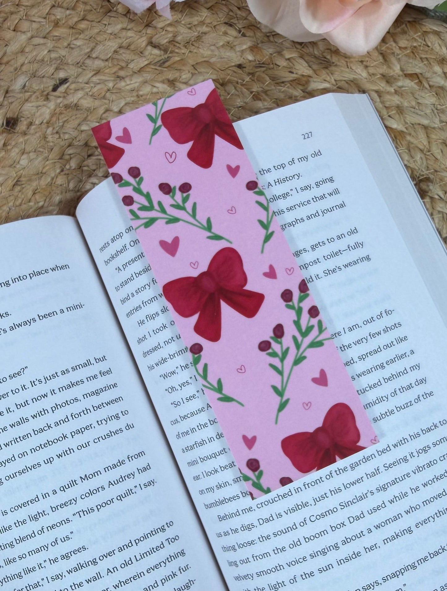 Bows & Blooms Bookmark marking a page inside a book.