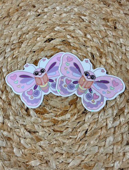 Butterfly Book Lover Vinyl Sticker shown in Vinyl Glossy and Vinyl Star Holographic finishes.