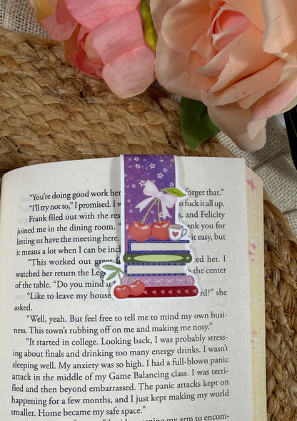 Cherry Books Magnetic Bookmark clipped to a page inside a book.
