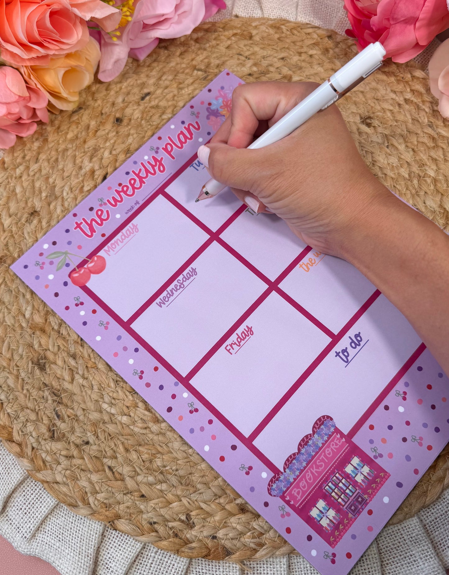 Cherry Books Weekly Planner with writing to demonstrate the weekly layout and writing space.