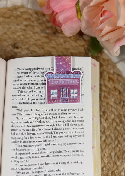 Cherry Bookstore Magnetic Bookmark clipped to a page inside a book.