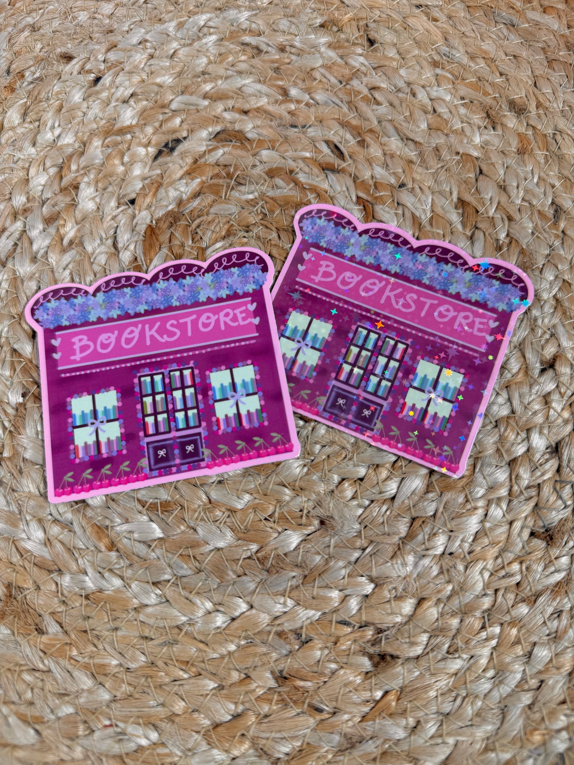 Cherry Bookstore Vinyl Sticker shown in Vinyl Glossy and Vinyl Star Holographic finishes.