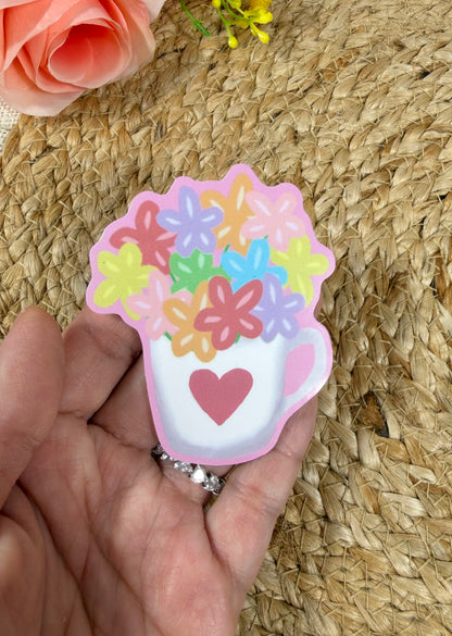 Close-up of the Flower Cup Vinyl Sticker in Vinyl Glossy finish held in hand.