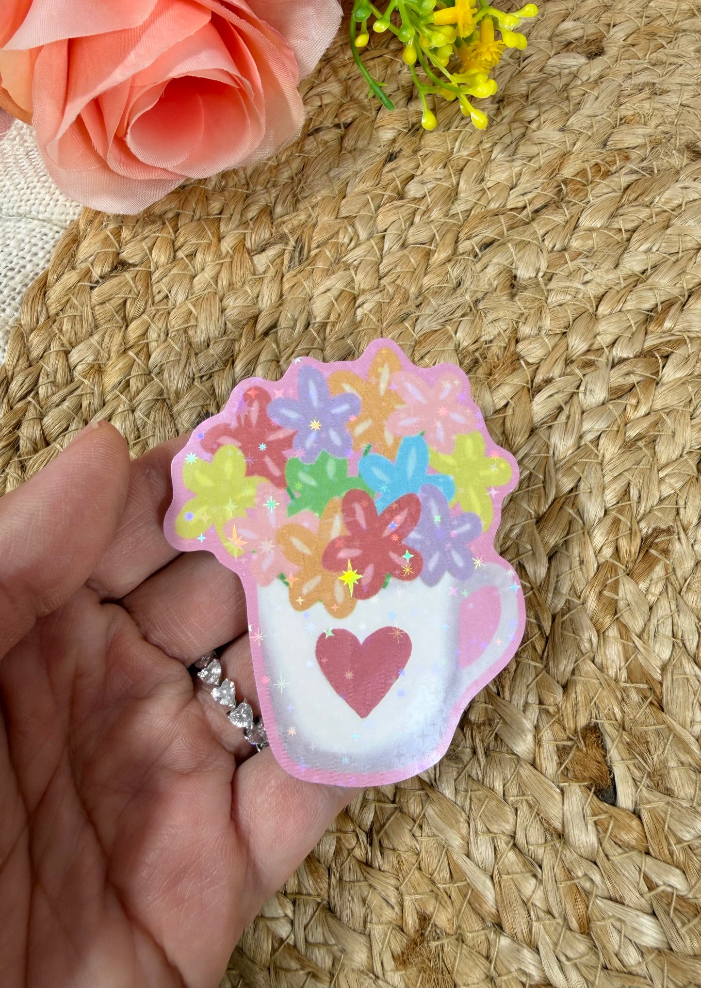 Close-up of the Flower Cup Vinyl Sticker in Vinyl Star Holographic finish held in hand.