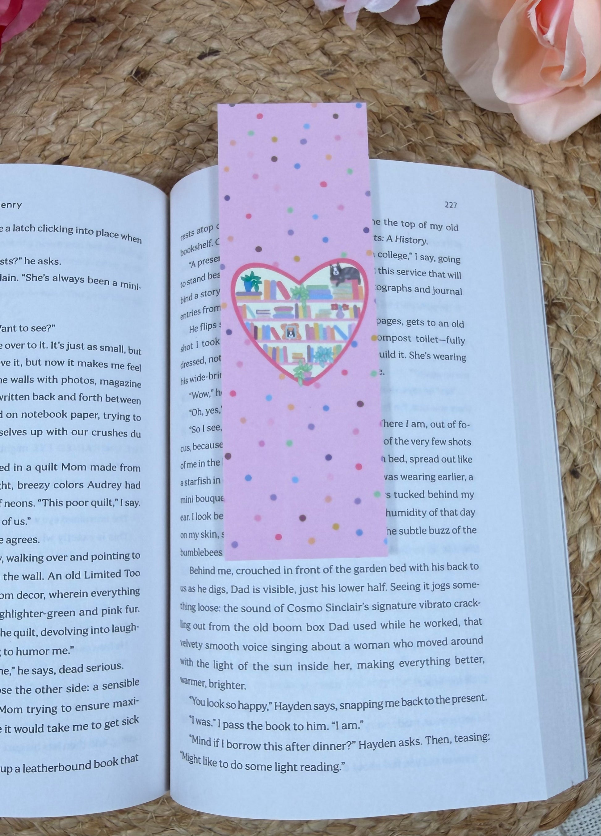Kitty's Library Bookmark marking a page inside a book.