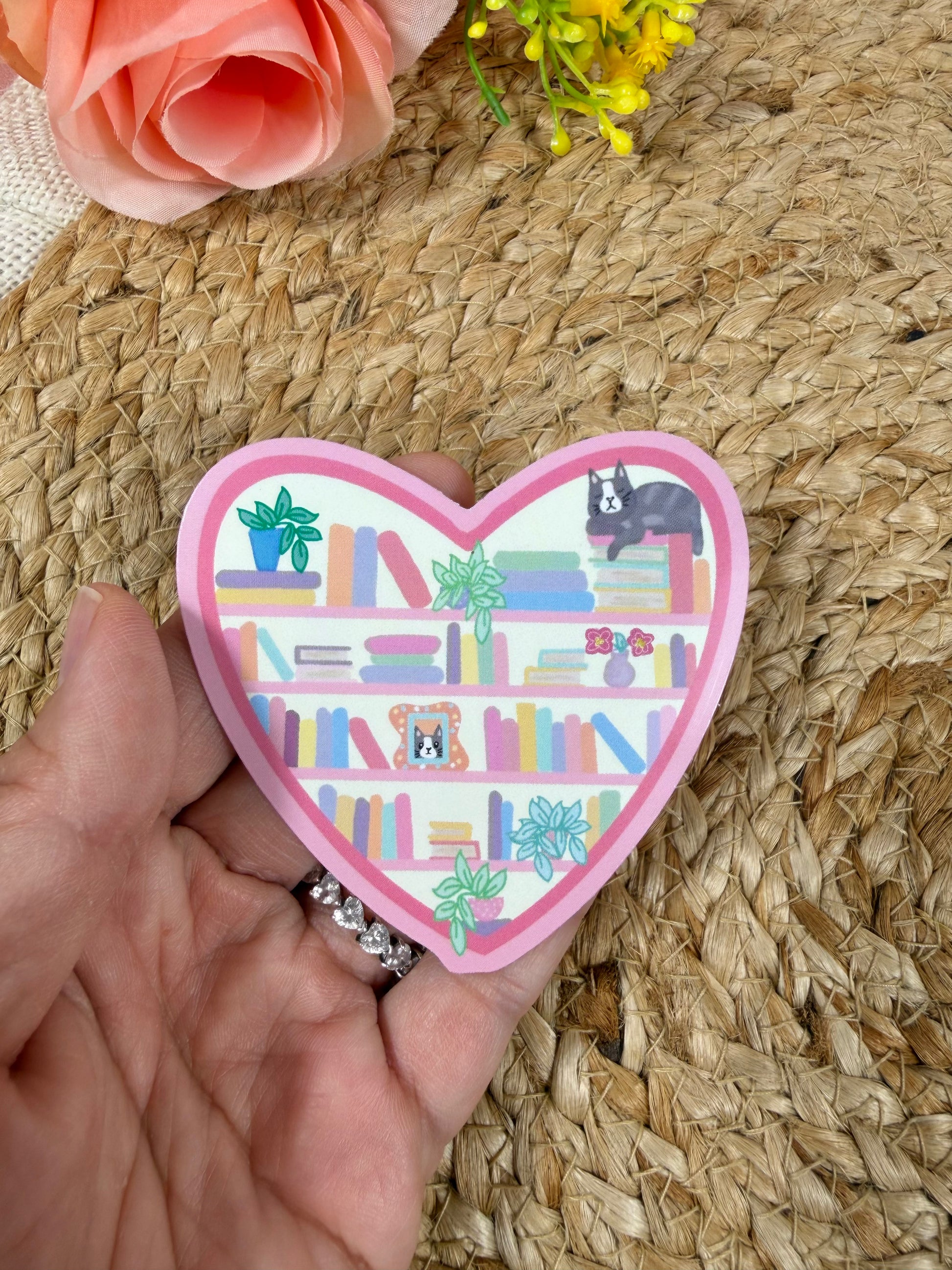 Close-up of the Kitty's Library Vinyl Sticker in Vinyl Glossy finish held in hand.
