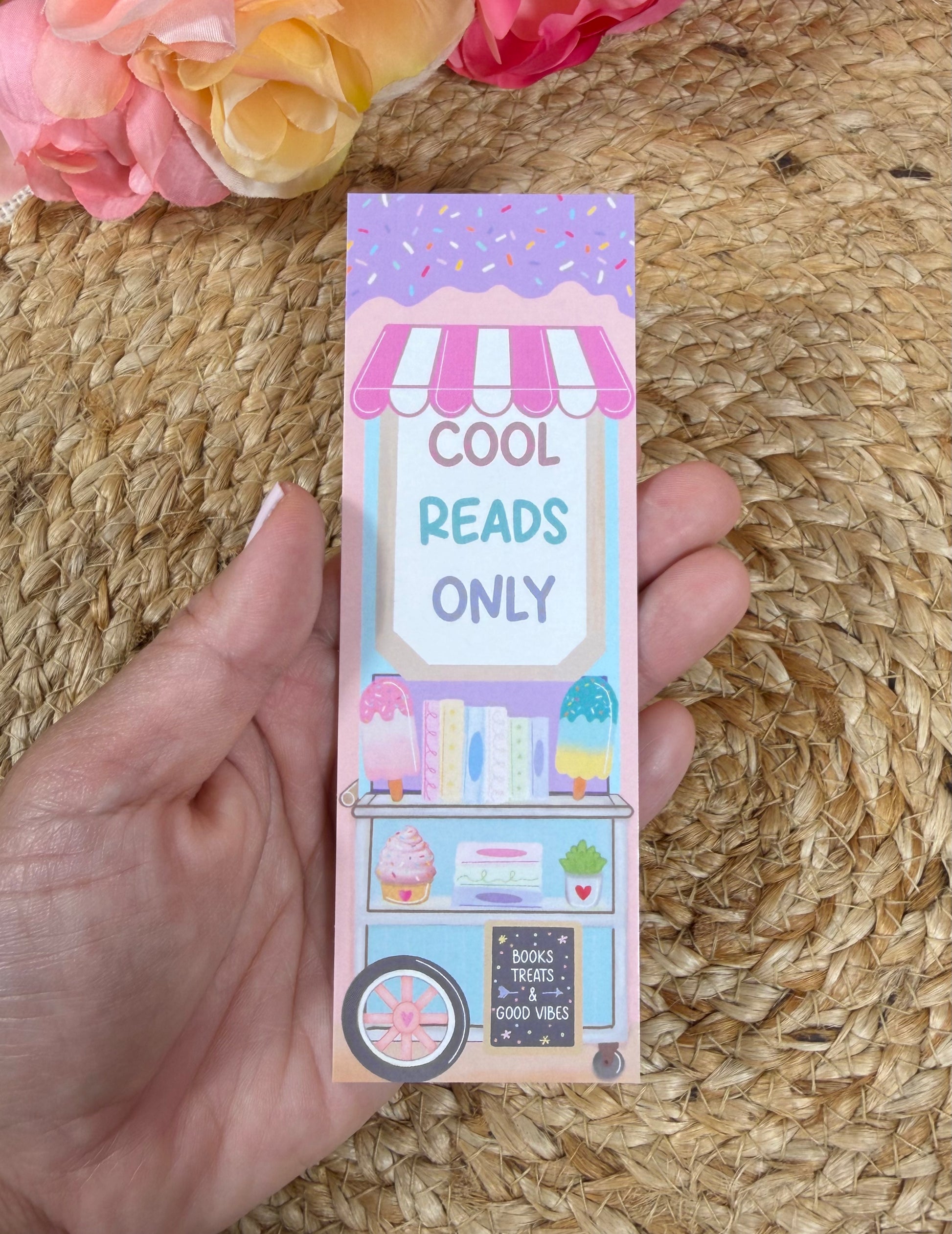 Popsicle Cart Bookmark held in hand.