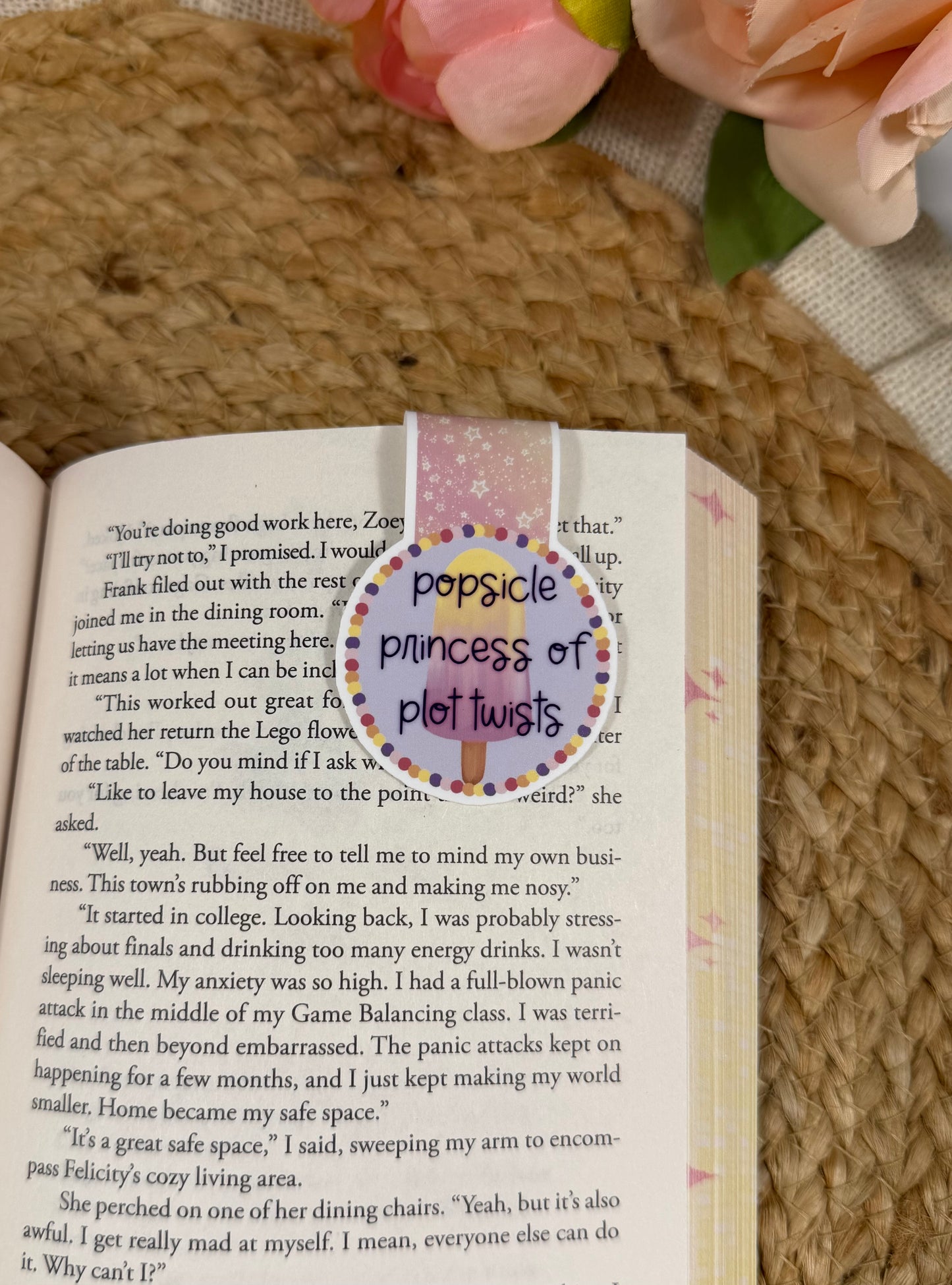 Popsicle Princess magnetic bookmark clipped to a book page, showing how it marks your place while reading.