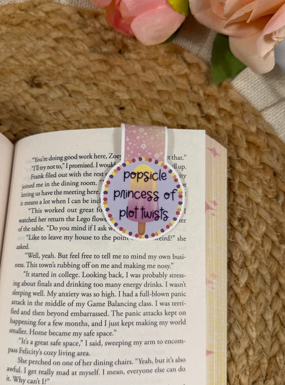 Popsicle Princess magnetic bookmark clipped to a book page, showing how it marks your place while reading.