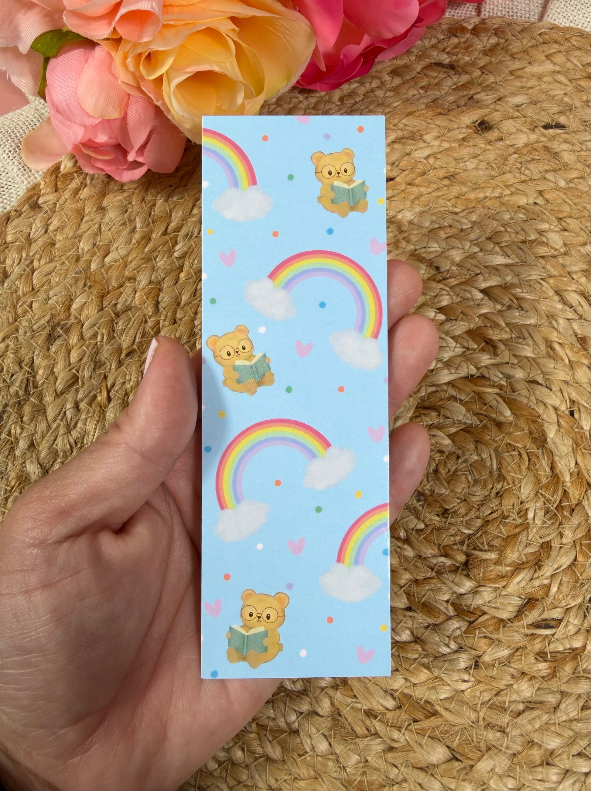 Rainbow Bear Bookmark held in hand.