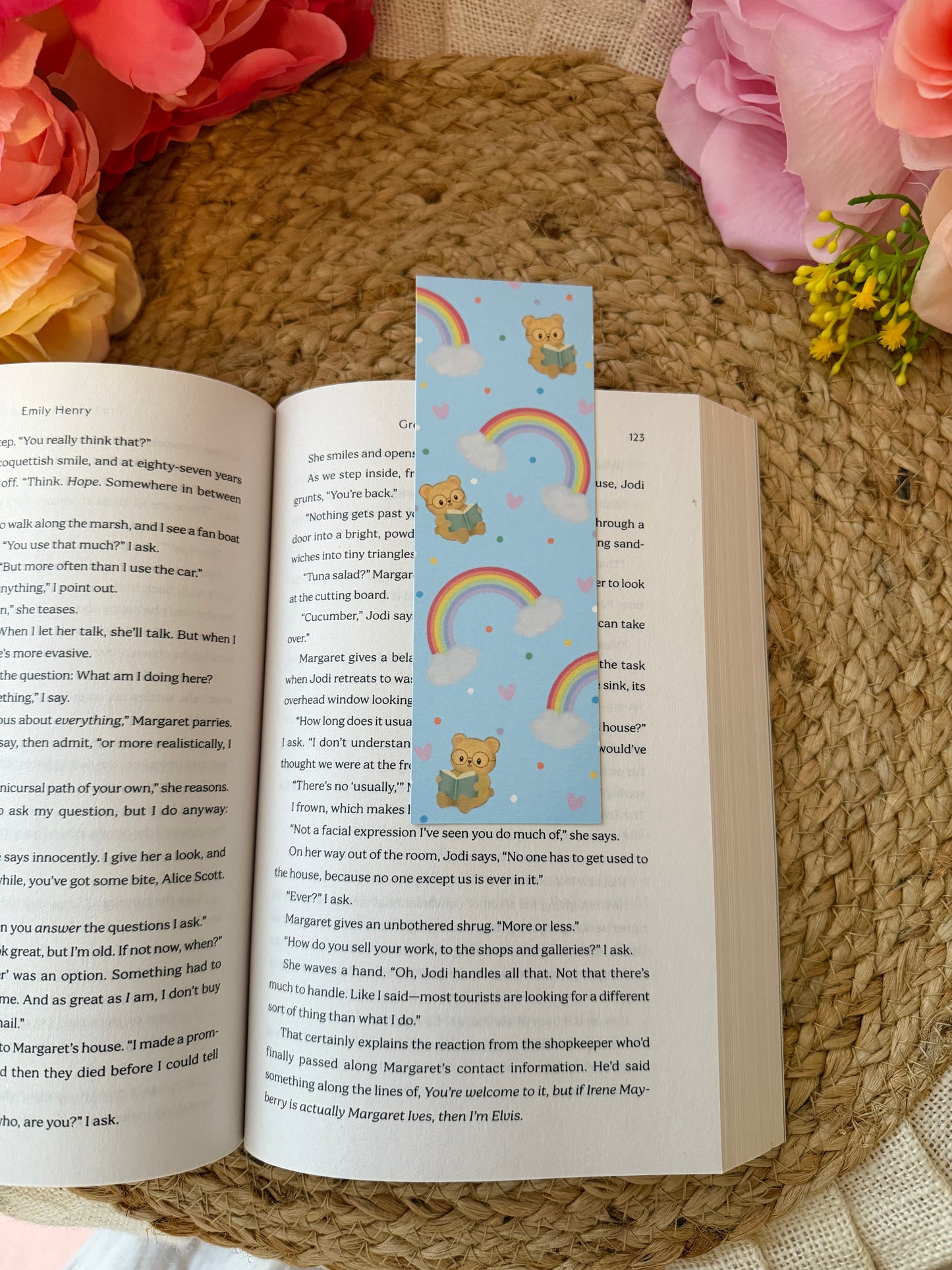 Rainbow Bear Bookmark marking a page inside a book.