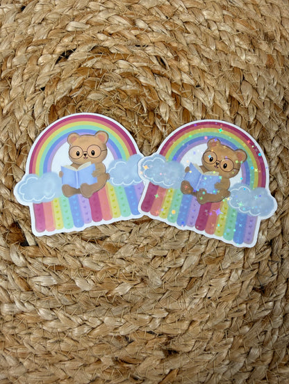 Rainbow Bear Vinyl Sticker shown in Vinyl Glossy and Vinyl Star Holographic finishes.