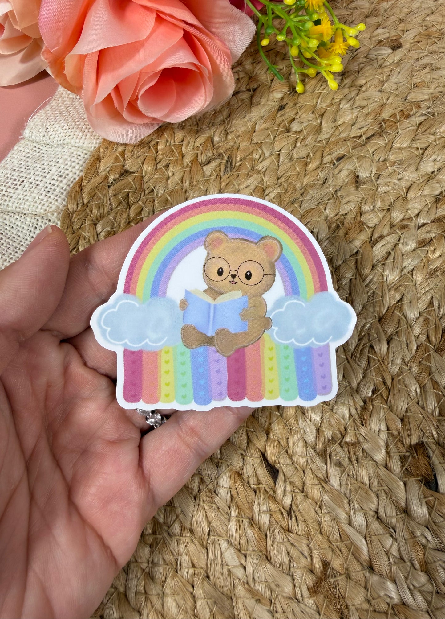 Close-up of the Rainbow Bear Vinyl Sticker in Vinyl Glossy finish held in hand.