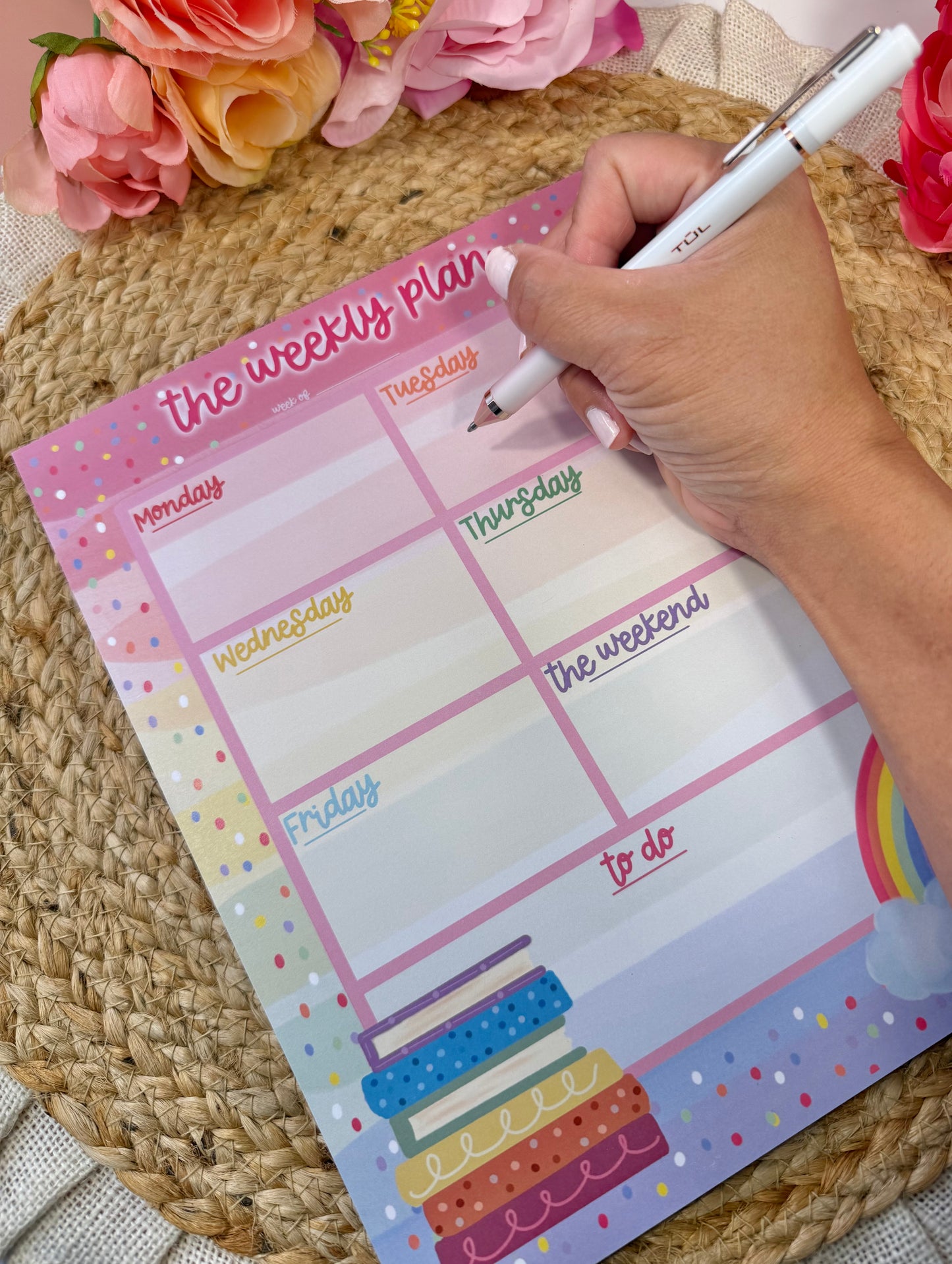Rainbow Books Weekly Planner with writing to demonstrate the weekly layout and writing space.