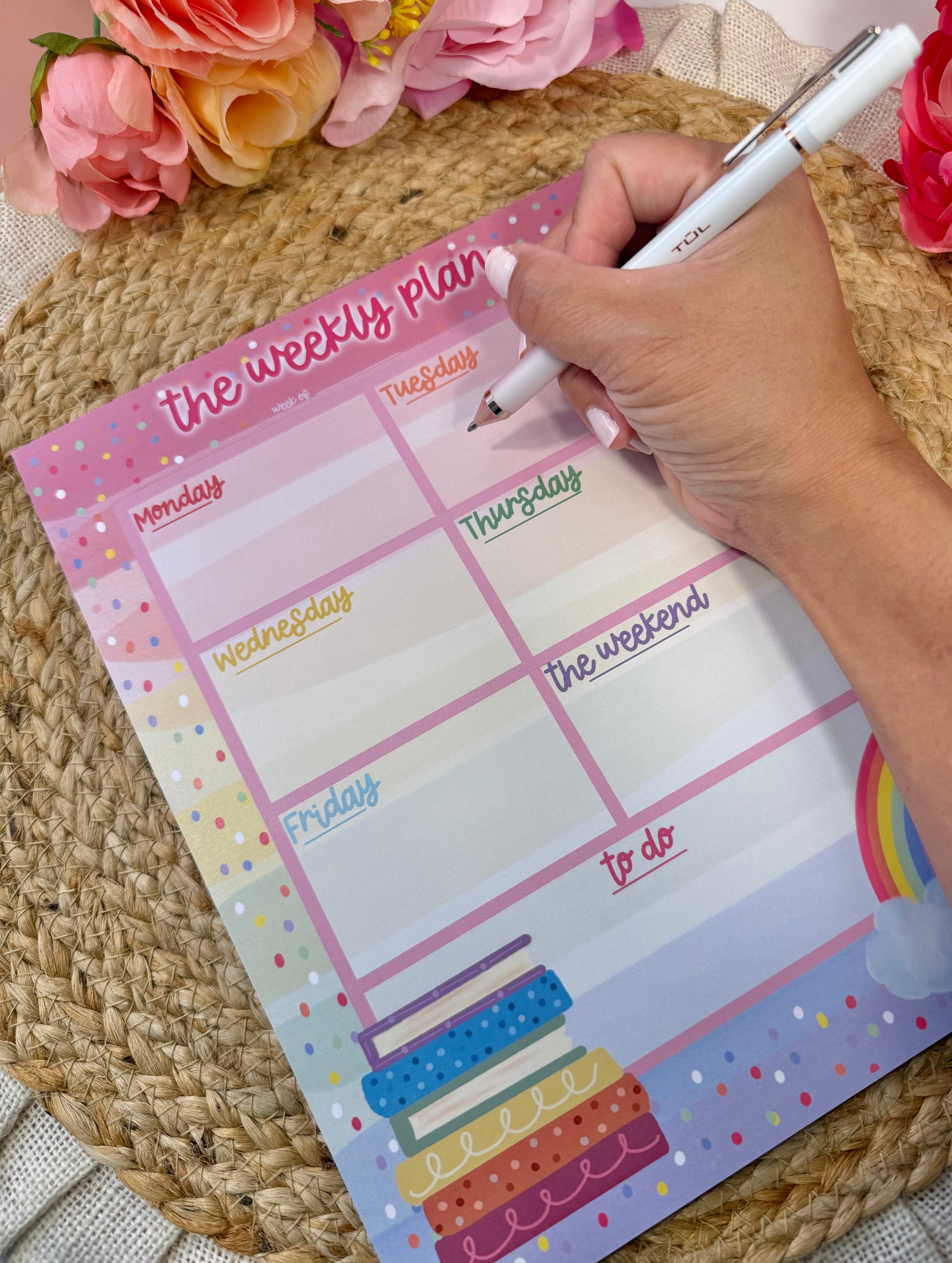 Rainbow Books Weekly Planner with writing to demonstrate the weekly layout and writing space.