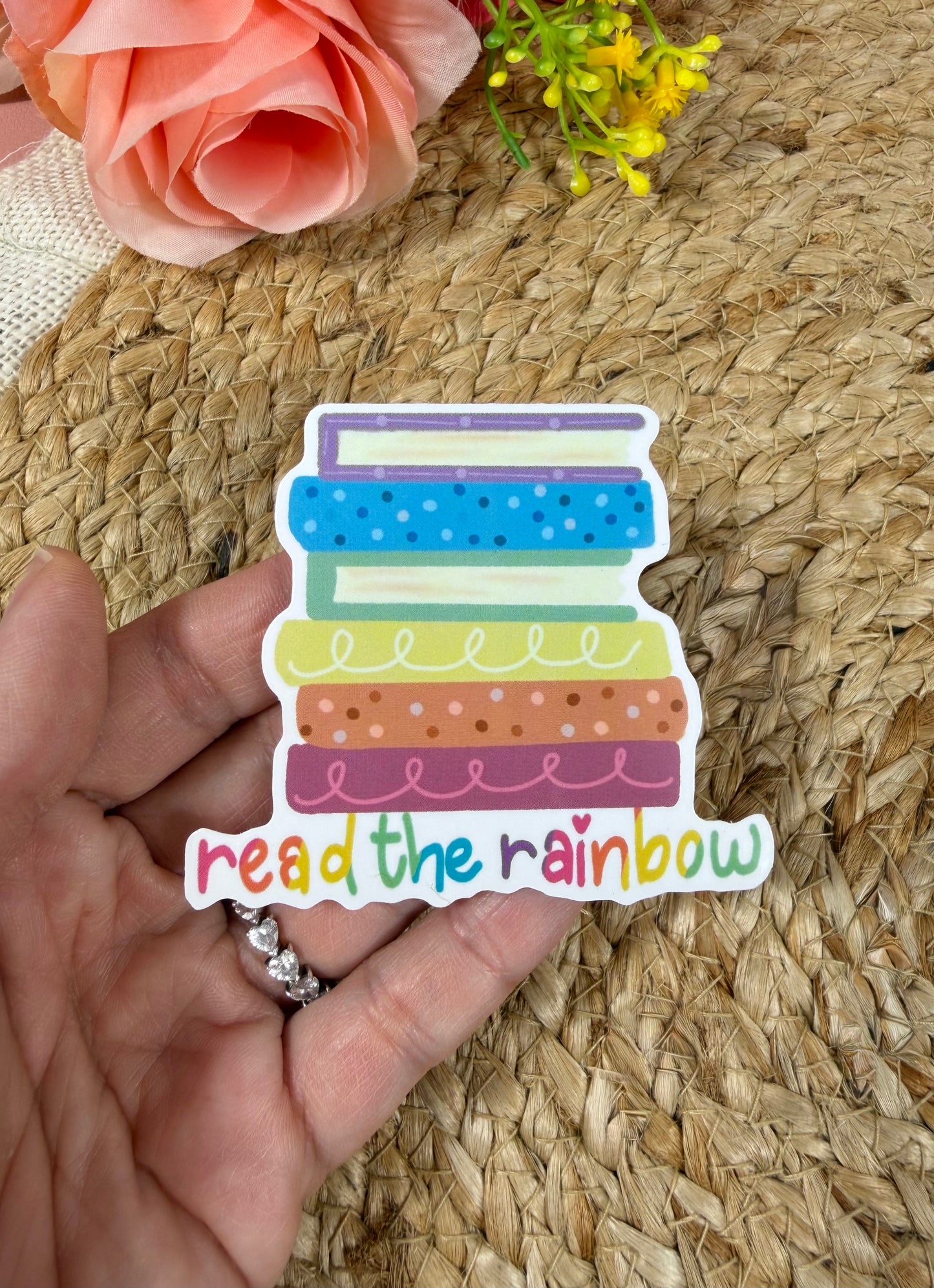 Close-up of the Reading Rainbow Vinyl Sticker in Vinyl Glossy finish held in hand.