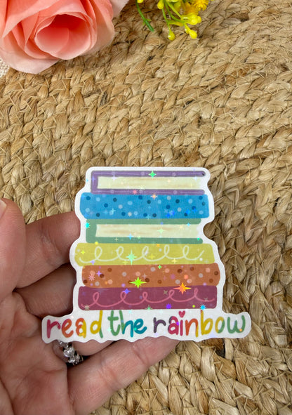 Close-up of the Reading Rainbow Vinyl Sticker in Vinyl Star Holographic finish held in hand.