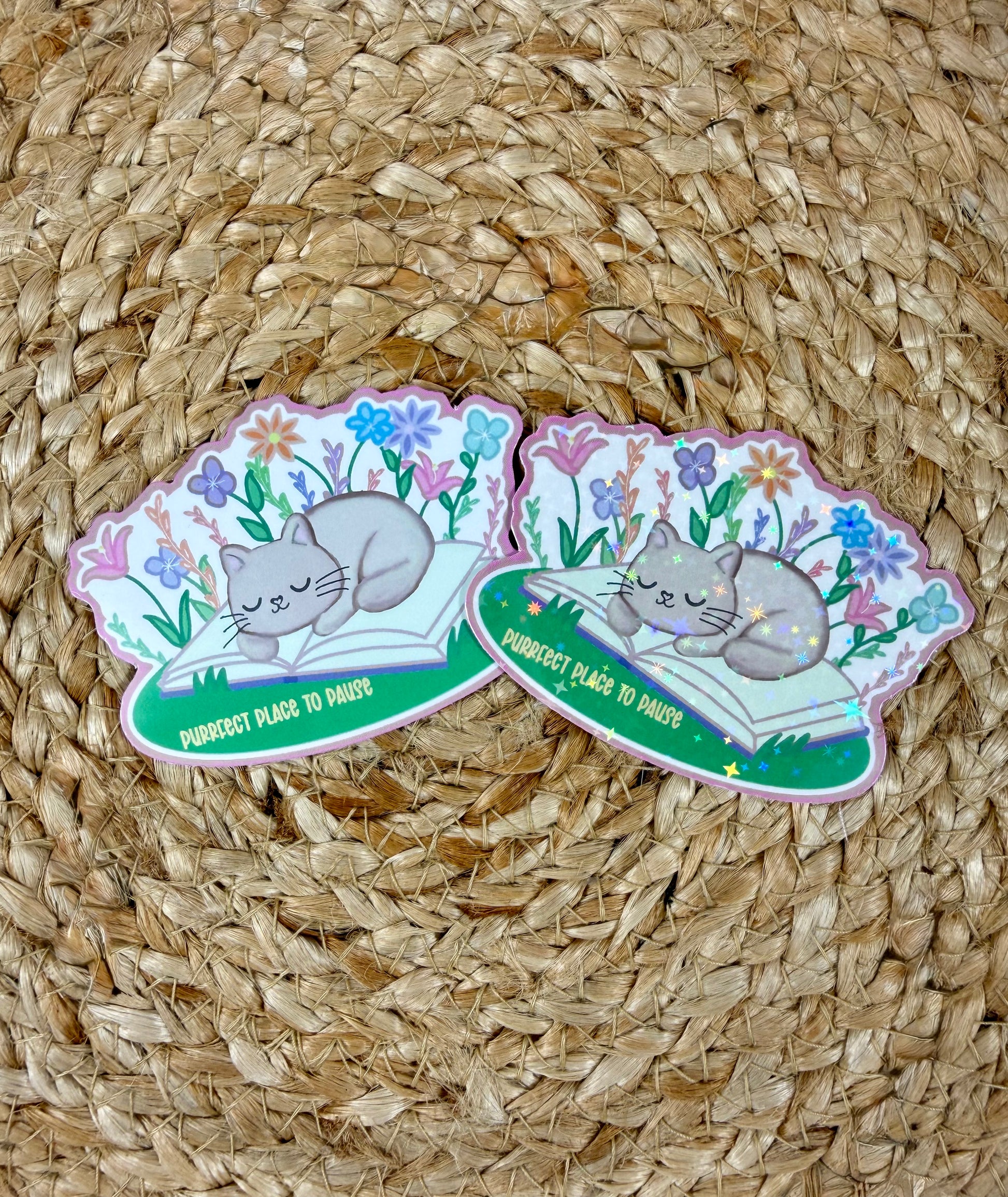 Sleepy Kitty Vinyl Sticker shown in Vinyl Glossy and Vinyl Star Holographic finishes.