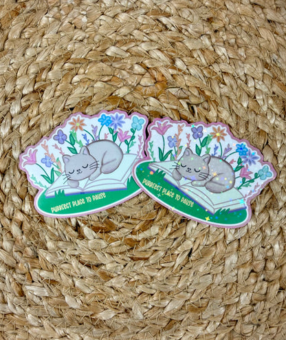 Sleepy Kitty Vinyl Sticker shown in Vinyl Glossy and Vinyl Star Holographic finishes.