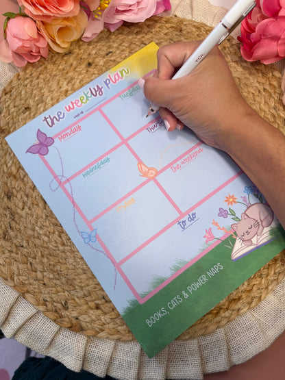 Sleepy Kitty Weekly Planner with writing to demonstrate the weekly layout and writing space.