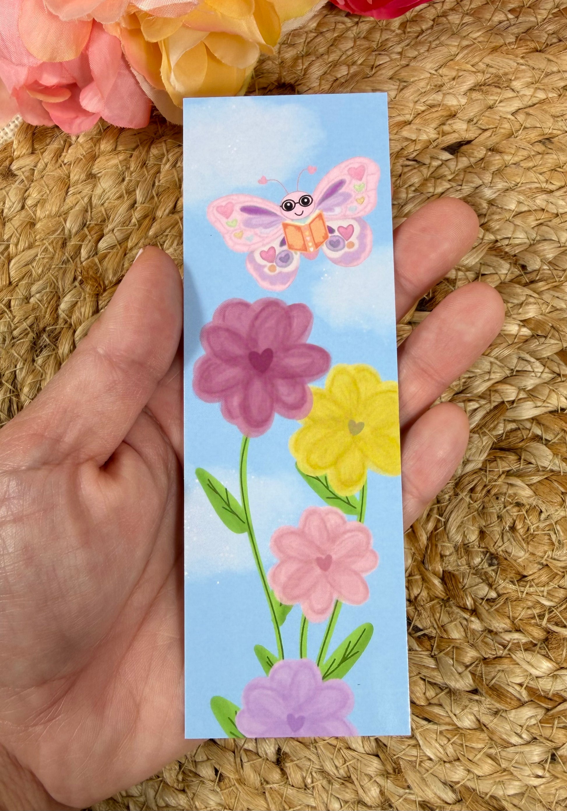 Spring Flight Bookmark held in hand.