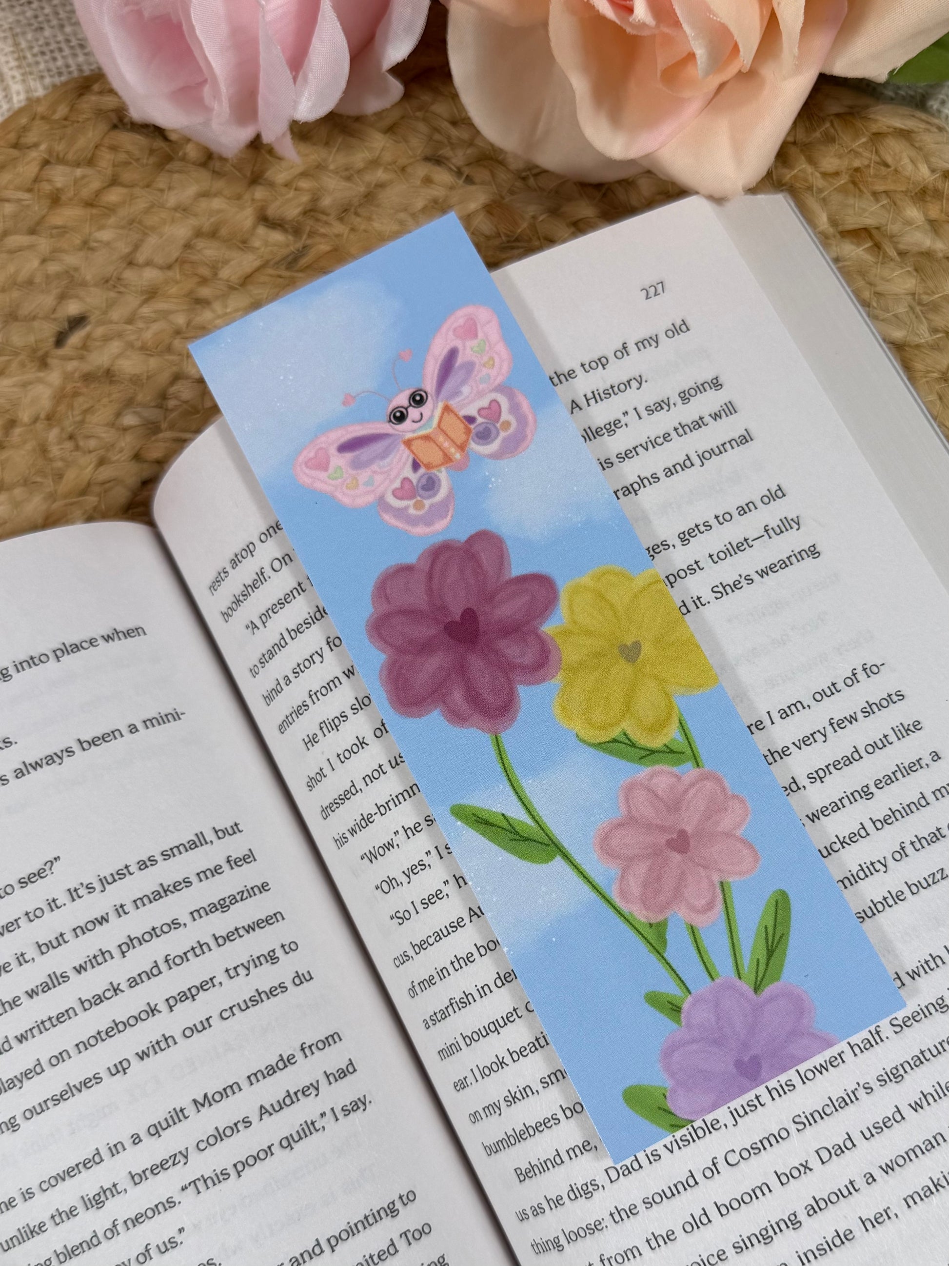 Spring Flight Bookmark marking a page inside a book.