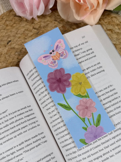 Spring Flight Bookmark marking a page inside a book.