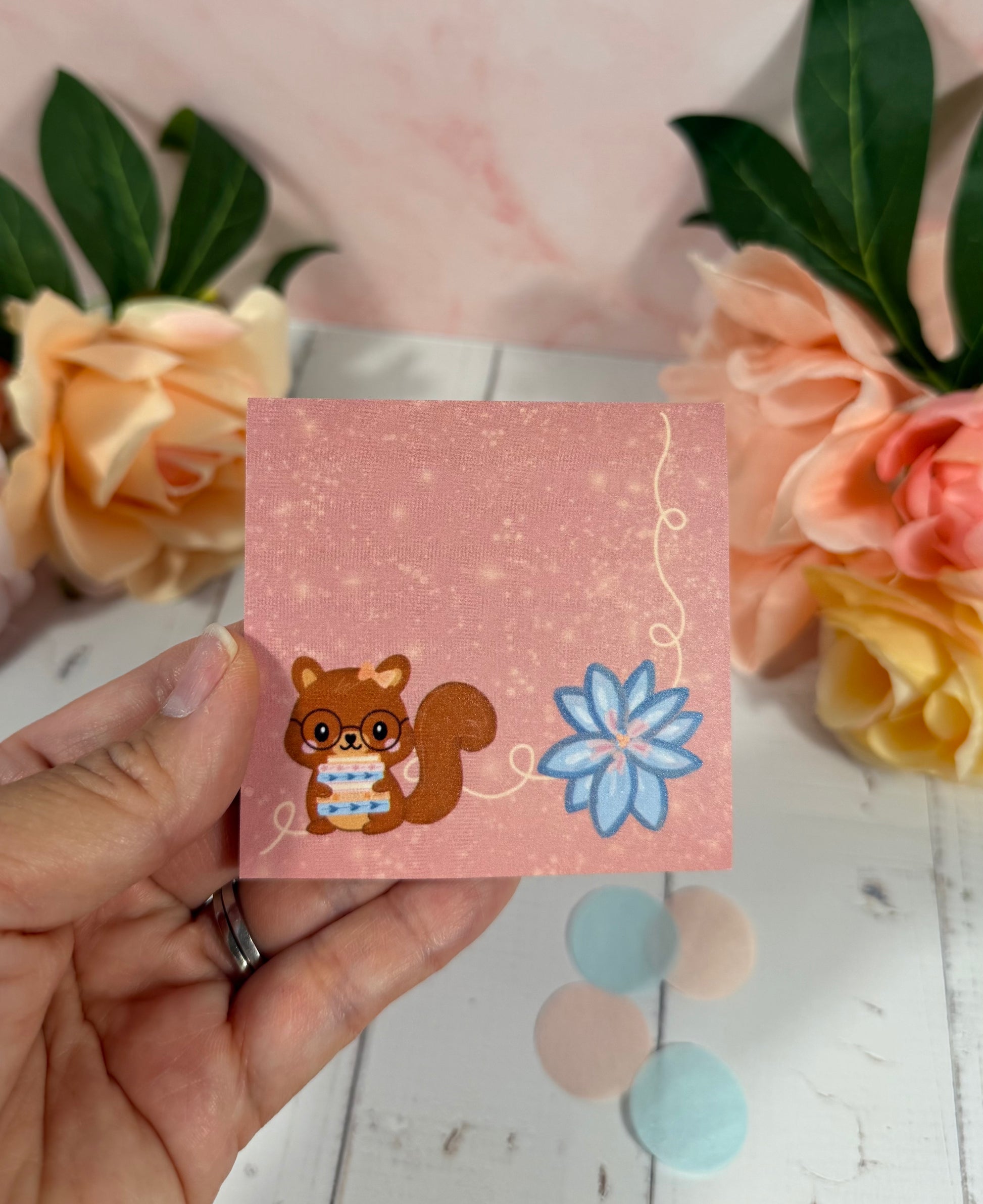 Storybook Squirrel Sticky Notes held in hand to show their size and design.