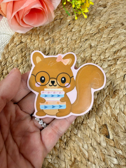 Close-up of the Storybook Squirrel Vinyl Sticker in Vinyl Glossy finish held in hand.