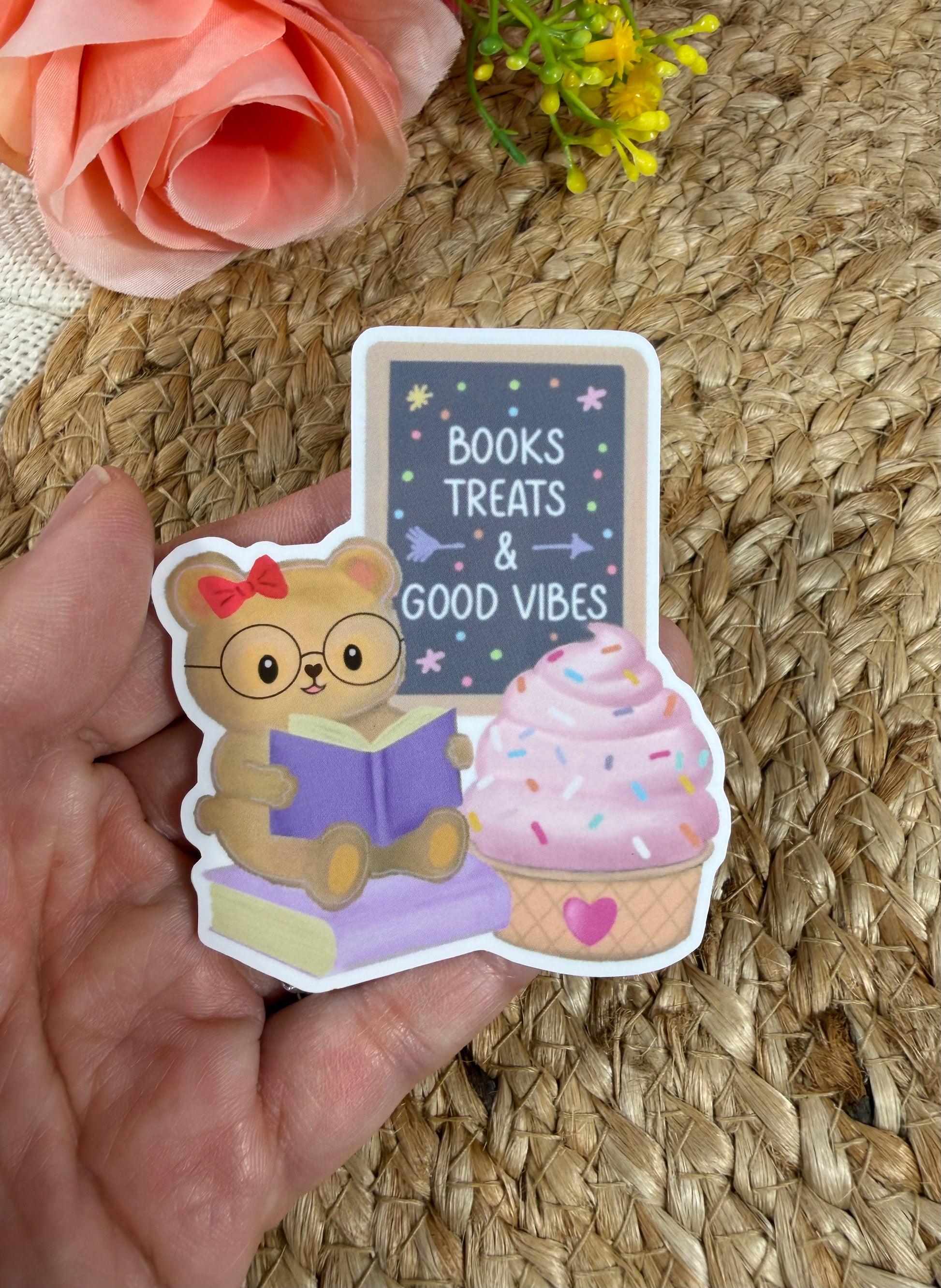 Close-up of the Sweet Tooth Teddy Vinyl Sticker in Vinyl Glossy finish held in hand.