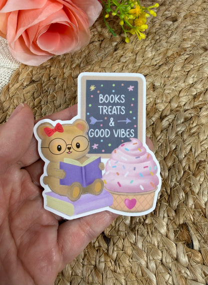 Close-up of the Sweet Tooth Teddy Vinyl Sticker in Vinyl Glossy finish held in hand.