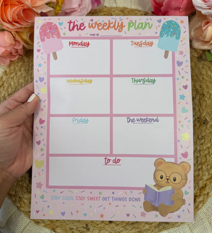 Sweet Tooth Teddy Weekly Planner held in hand to show its size and design.